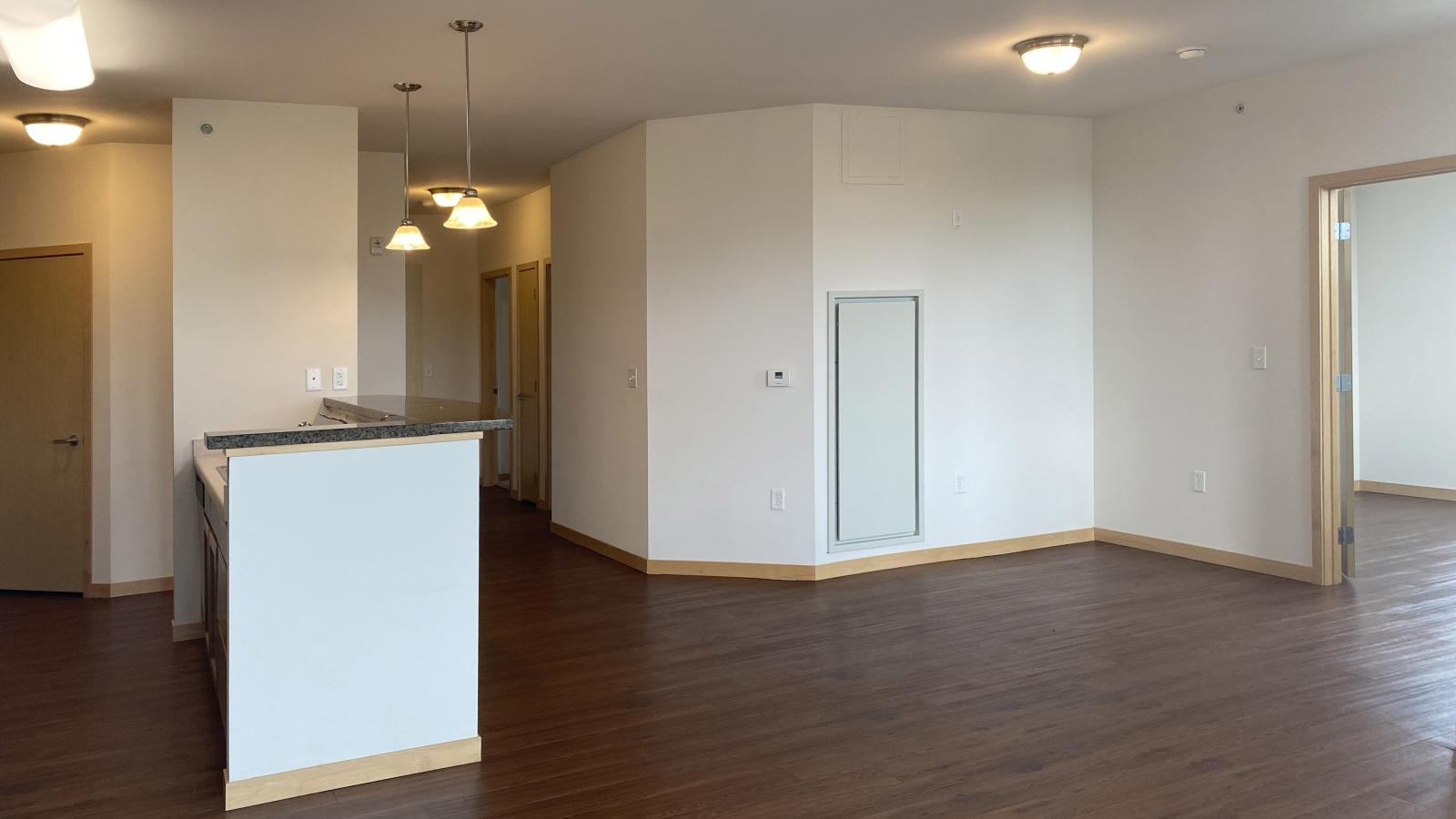 Spacious two bedroom den apartment featuring large living and dining space and ample natural light at The Depot in downtown Madison