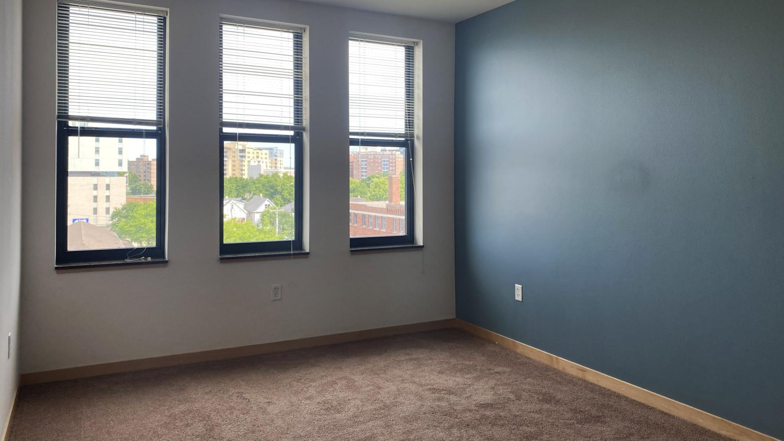 Spacious two bedroom den apartment featuring a walk in closet and ample natural light at The Depot in downtown Madison