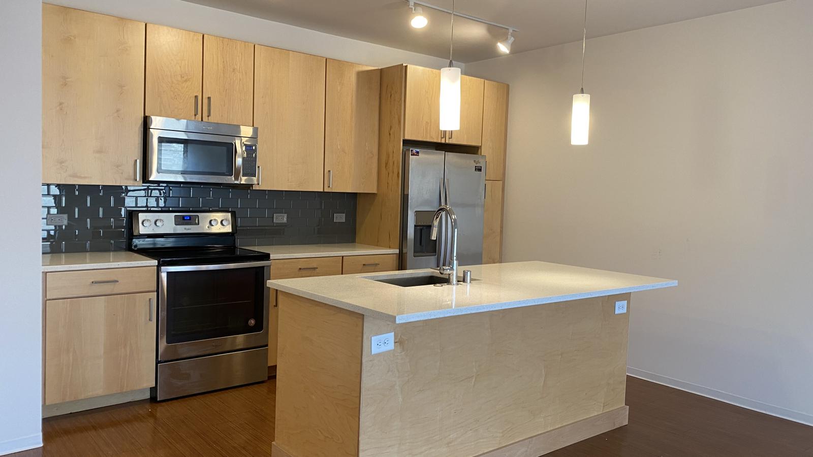 Kitchen with eat in breakfast bar and spacious counter space at SEVEN27
