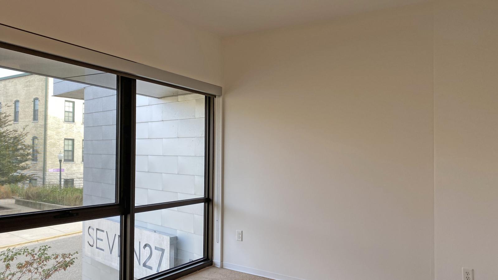 One bedroom with open layout and standard closet for ample storage at SEVEN27