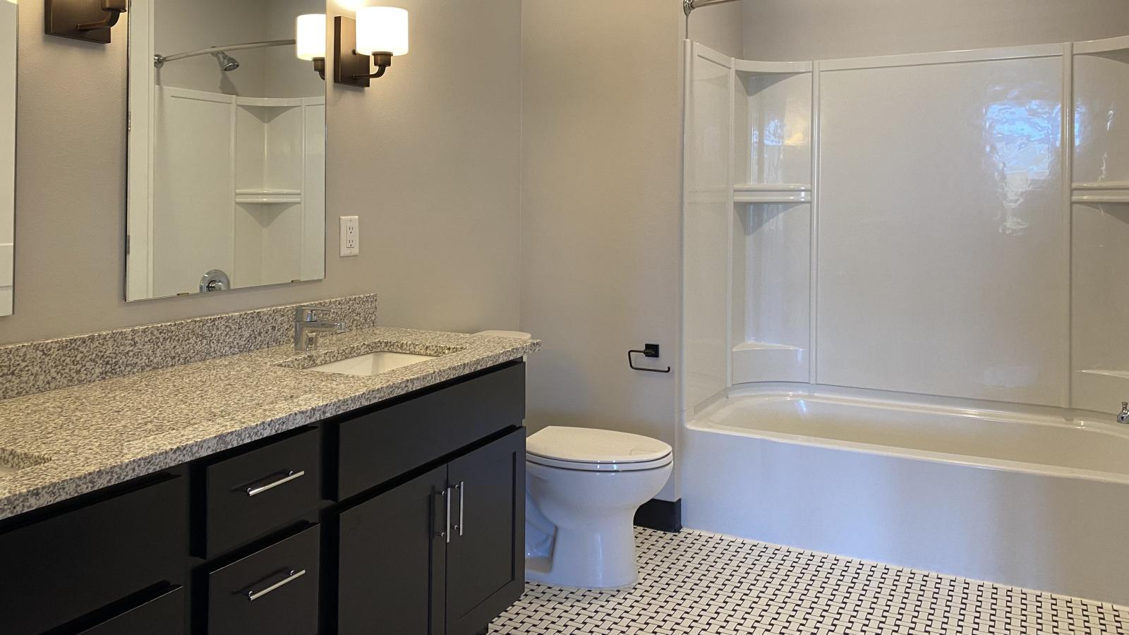 1722 Monroe three-bedroom apartment in Madison with classic tile bathrooms and a spacious living area.