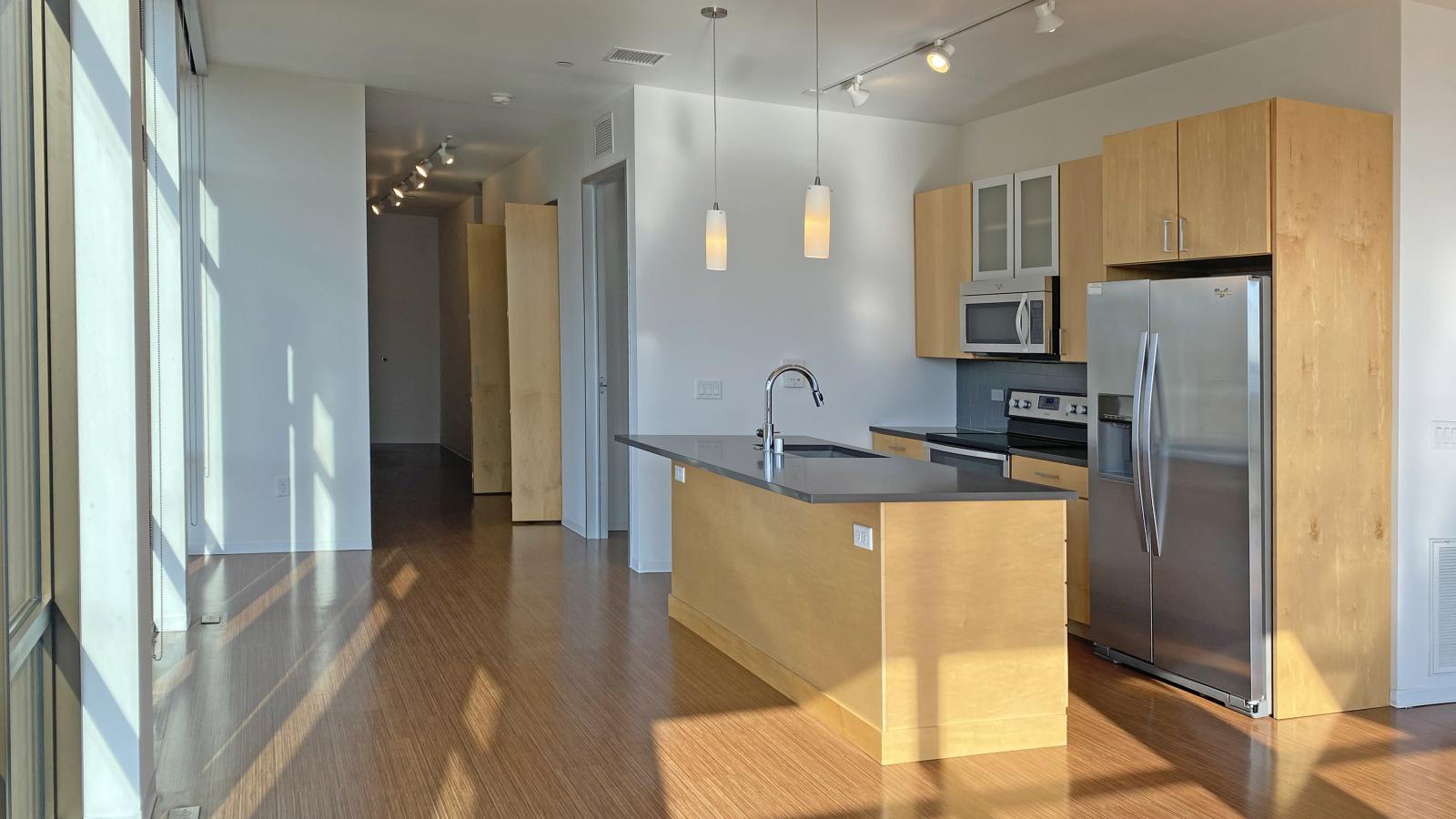 Two bedroom apartment kitchen featuring ample counter space and luxury finishes at SEVEN27