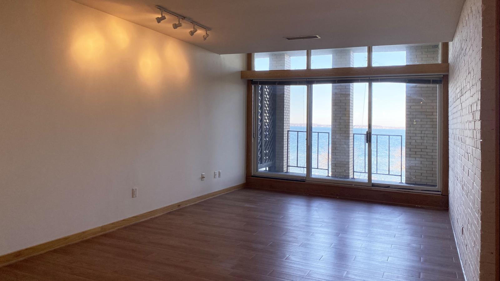 One-bedroom plus den apartment with private balcony and Lake Mendota views at Lincoln School