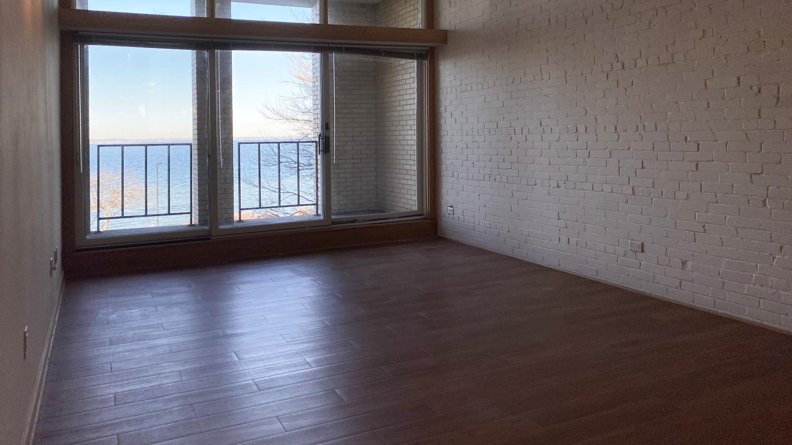 One-bedroom plus den apartment with private balcony and Lake Mendota views at Lincoln School
