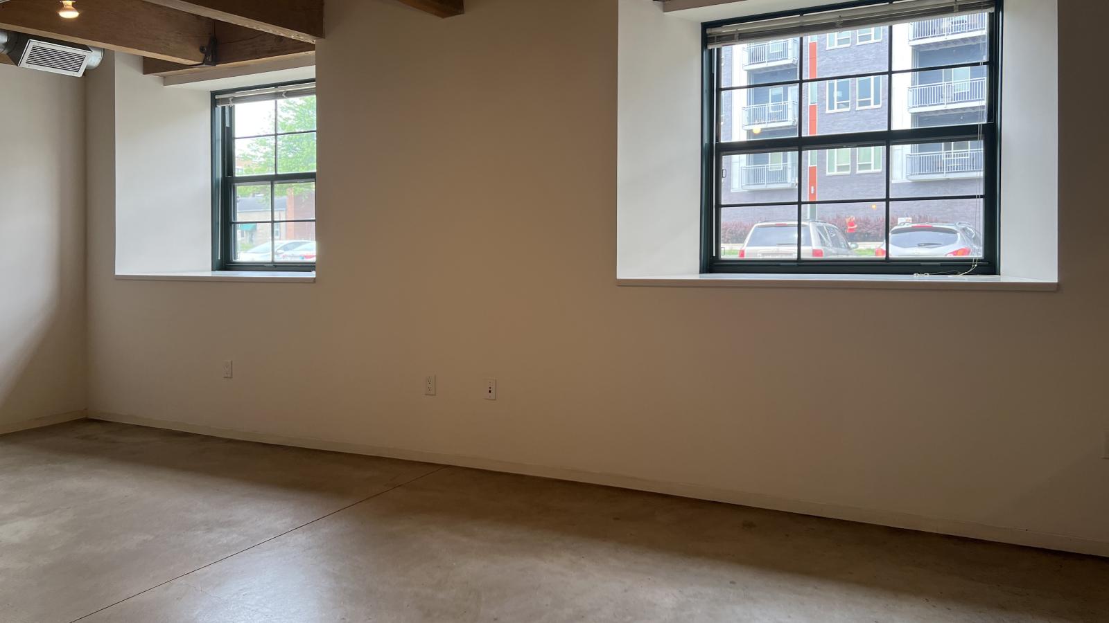 Studio apartment featuring polished concrete floors, soft industrial accents at Tobacco Lofts