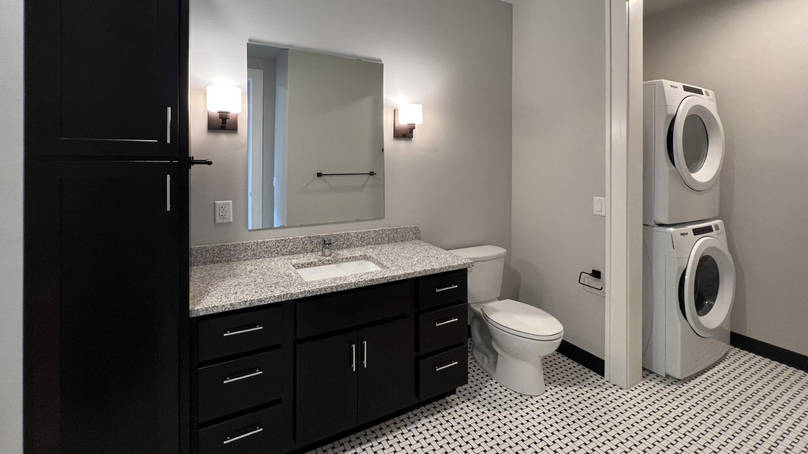 Modern one bedroom bathroom at 1722 Monroe Apartments in Madison with classic tile and laundry