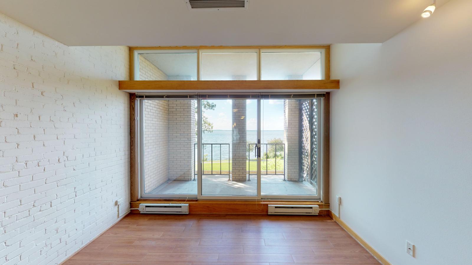 One-bedroom plus den apartment with private balcony and Lake Mendota views at Lincoln School