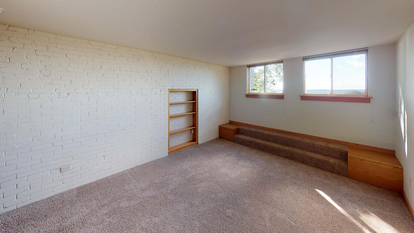 Bright bedroom with natural light and direct lake views at Lincoln School