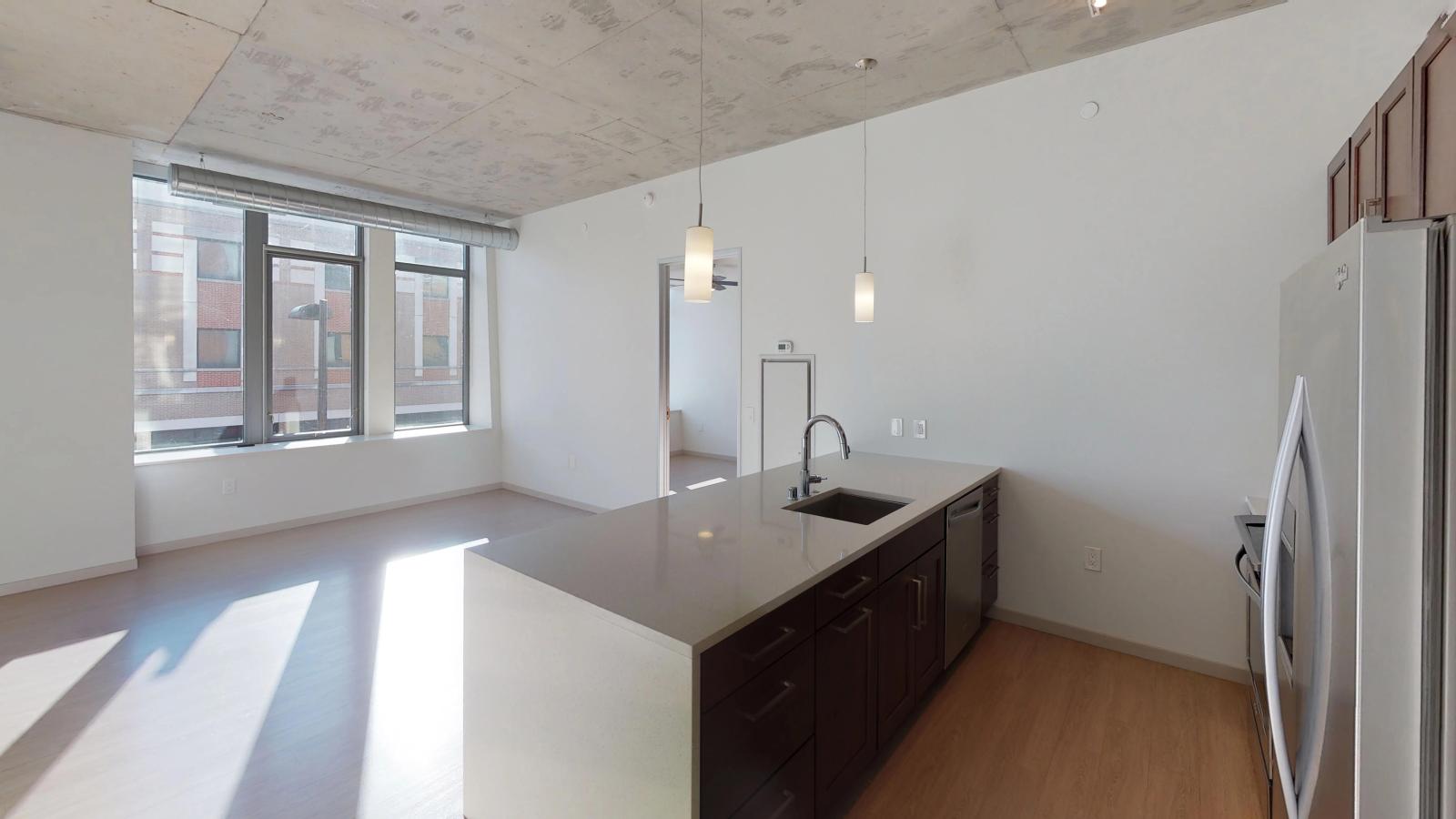 Modern one-bedroom apartment at The Pressman in downtown Madison with an open floor plan and natural light.