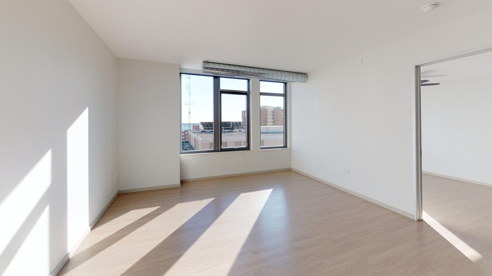 Bright one-bedroom apartment at The Pressman in downtown Madison with open-concept living and lake views.