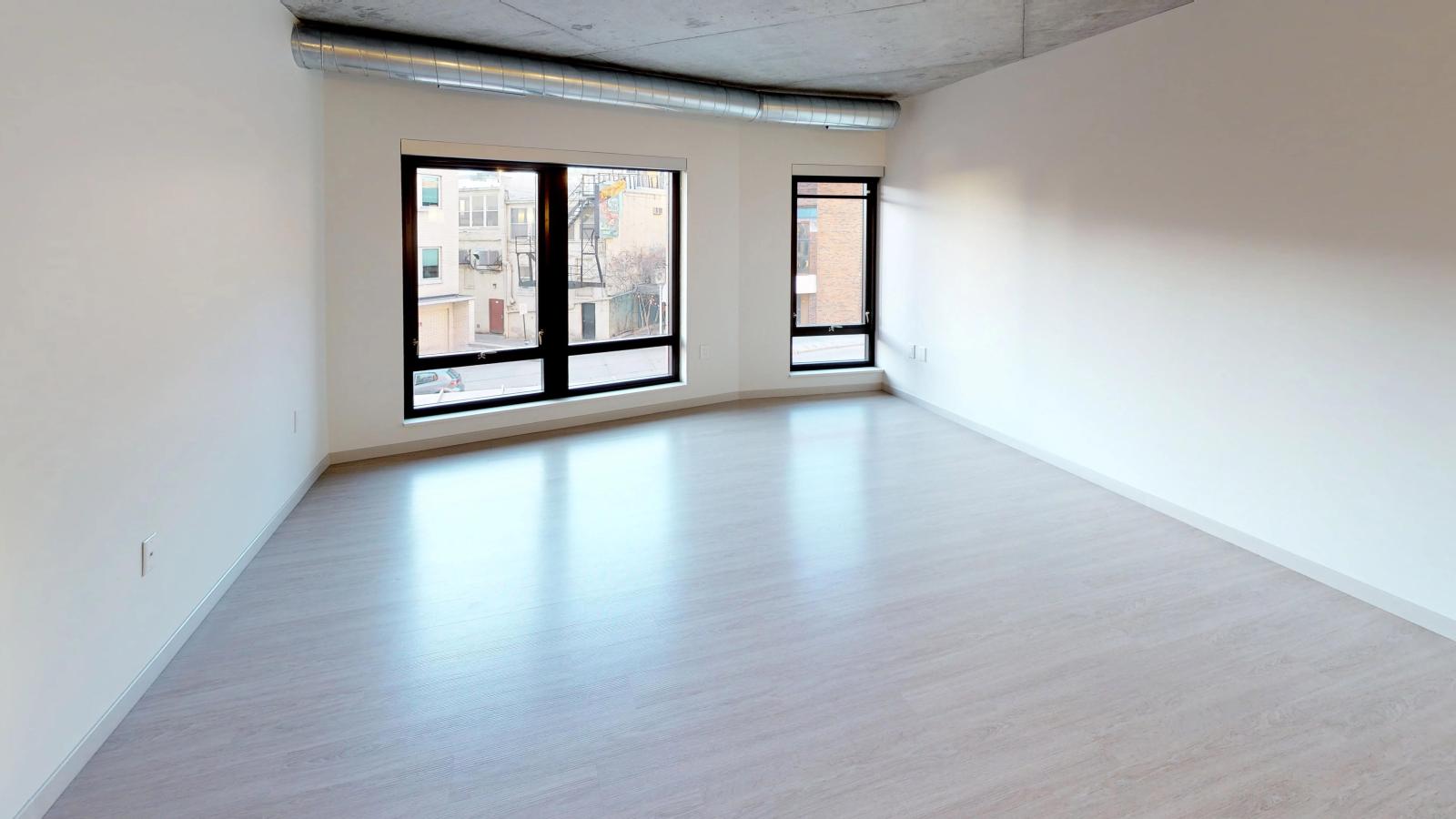 Modern one-bedroom apartment at The Pressman in downtown Madison with an open floor plan and natural light.