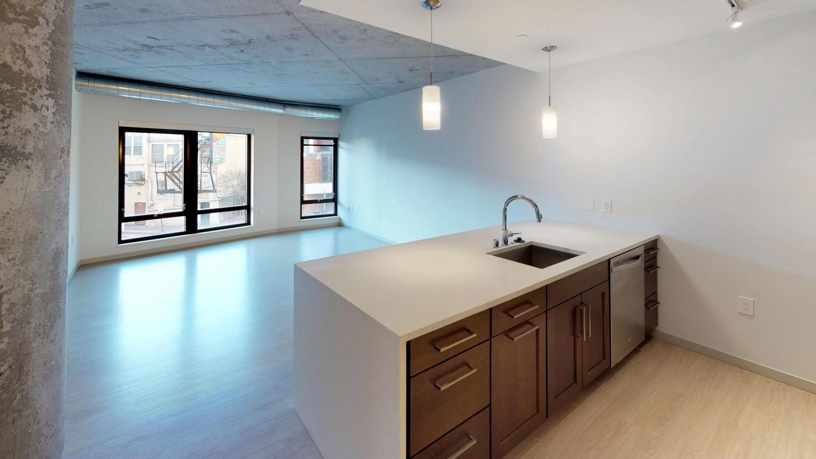 Modern one-bedroom apartment at The Pressman in downtown Madison with an open floor plan and natural light.