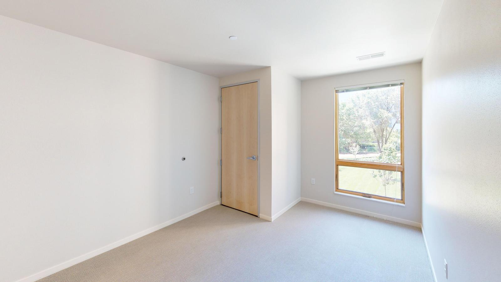 Quarter Row two-bedroom plus den apartment in downtown Madison featuring a stylish interior, contemporary finishes, and modern layout.