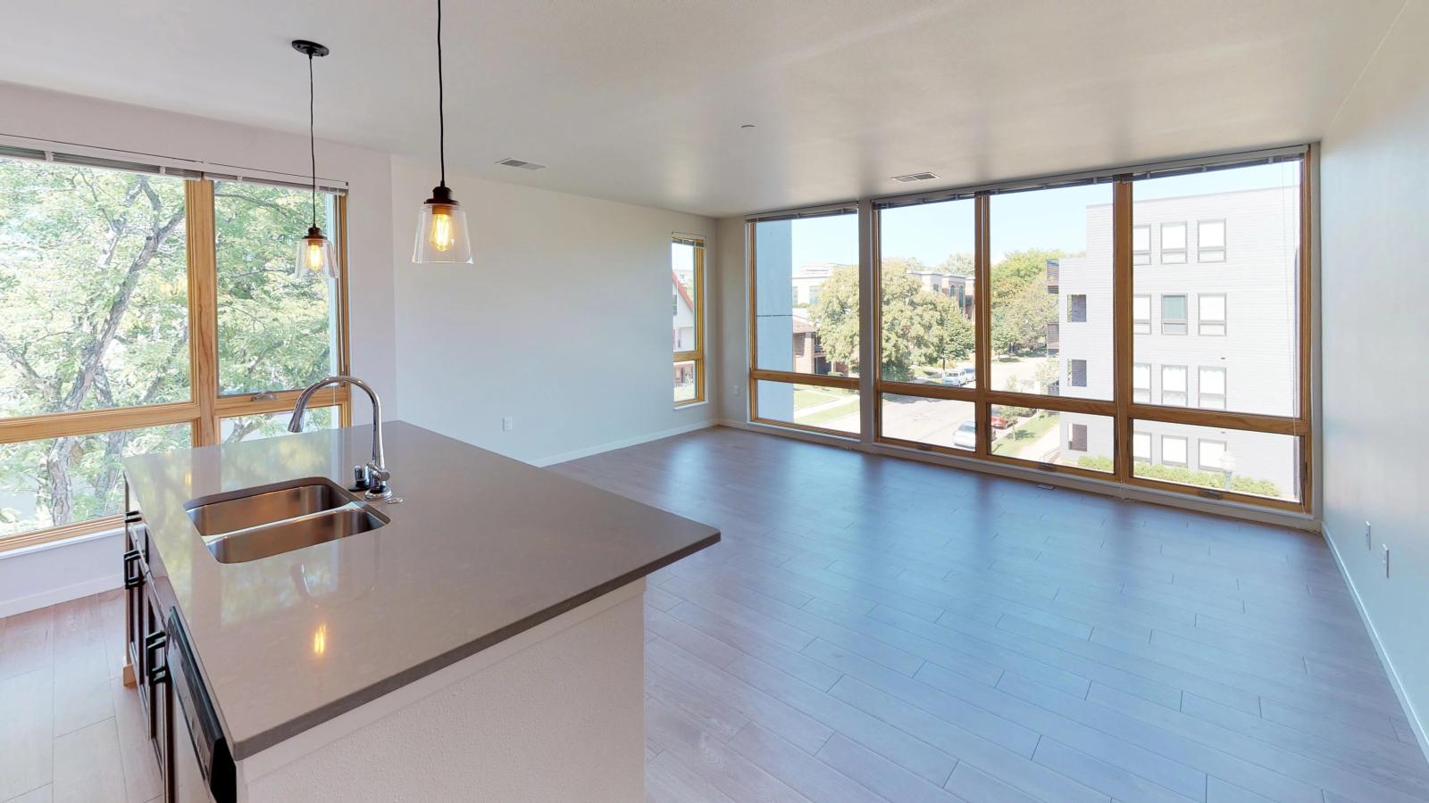 Stylish two-bedroom apartment at Quarter Row Apartments in downtown Madison featuring large windows and premium interior finishes.