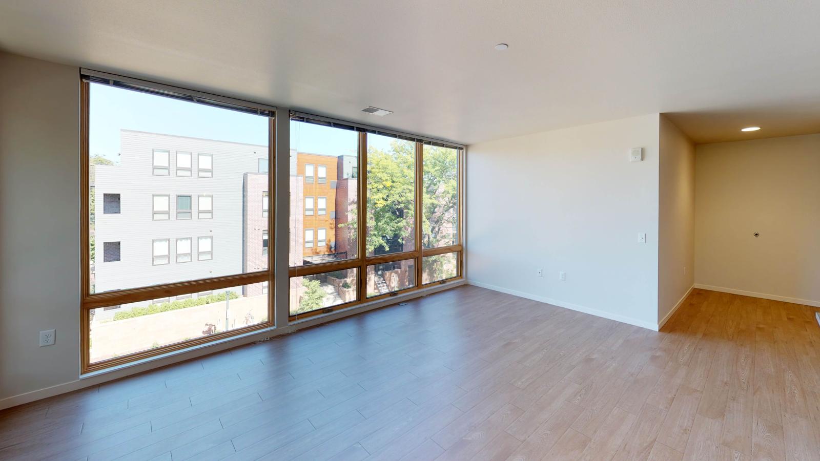 Stylish two-bedroom apartment at Quarter Row Apartments in downtown Madison featuring large windows and premium interior finishes.