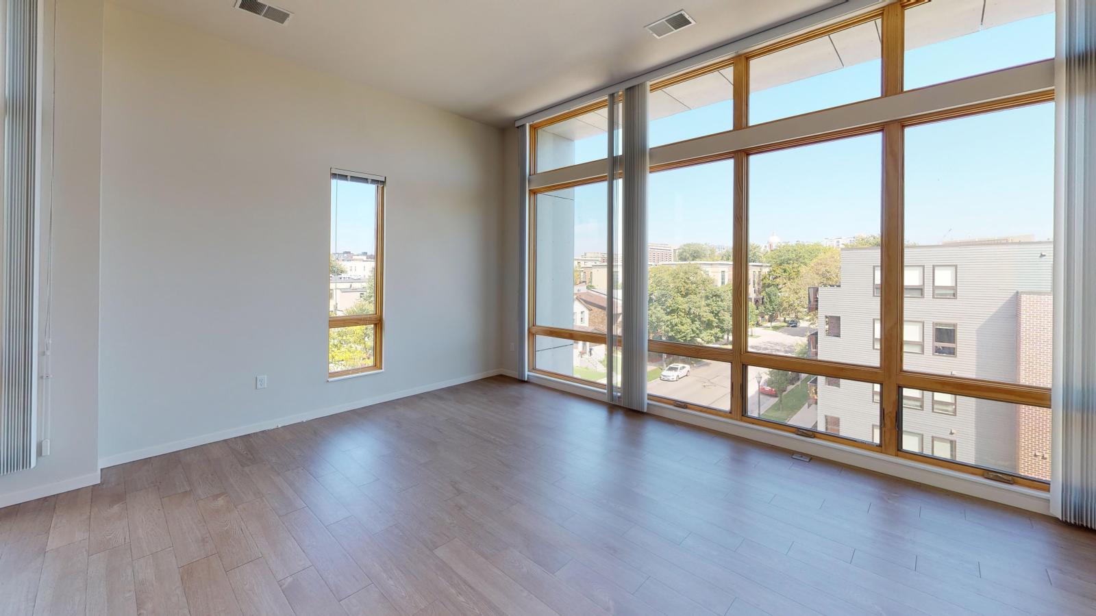 Stylish two-bedroom apartment at Quarter Row Apartments in downtown Madison featuring large windows and premium interior finishes.