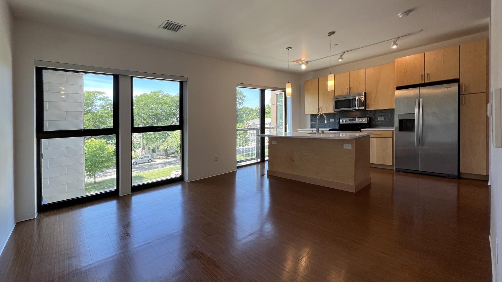 Luxury one bedroom apartment with Juliette balcony and abundant light at SEVEN27 in downtown Madison