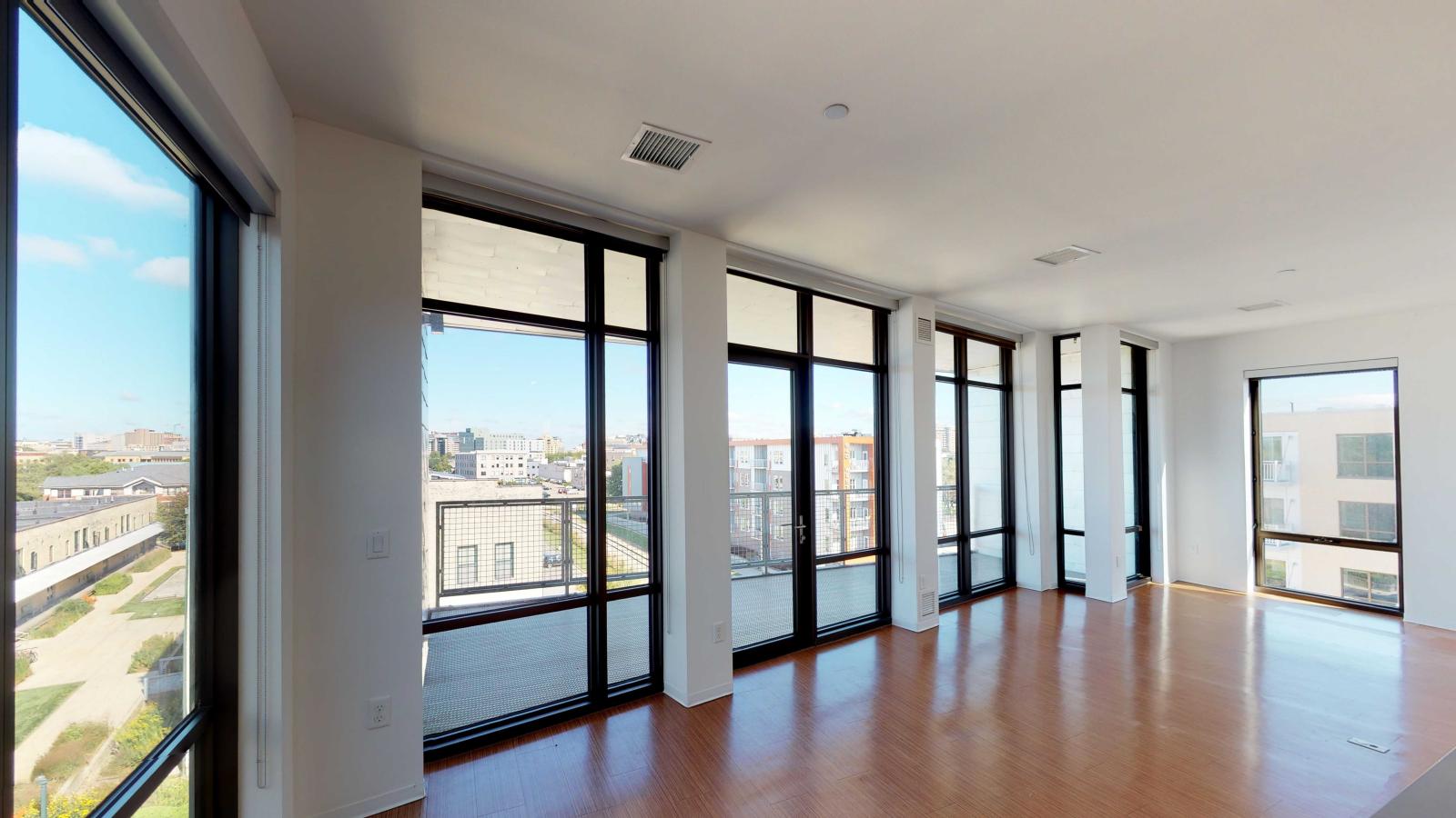 Living space with large windows and partial Capitol views at SEVEN27