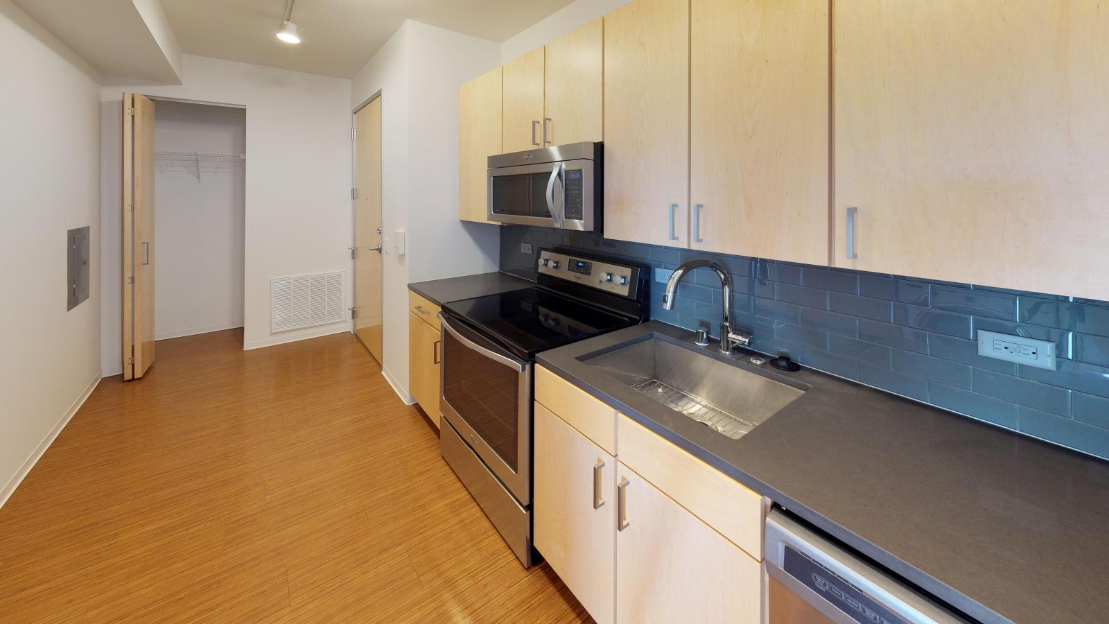 Luxury kitchen with high end finishes and quartz countertops at SEVEN27