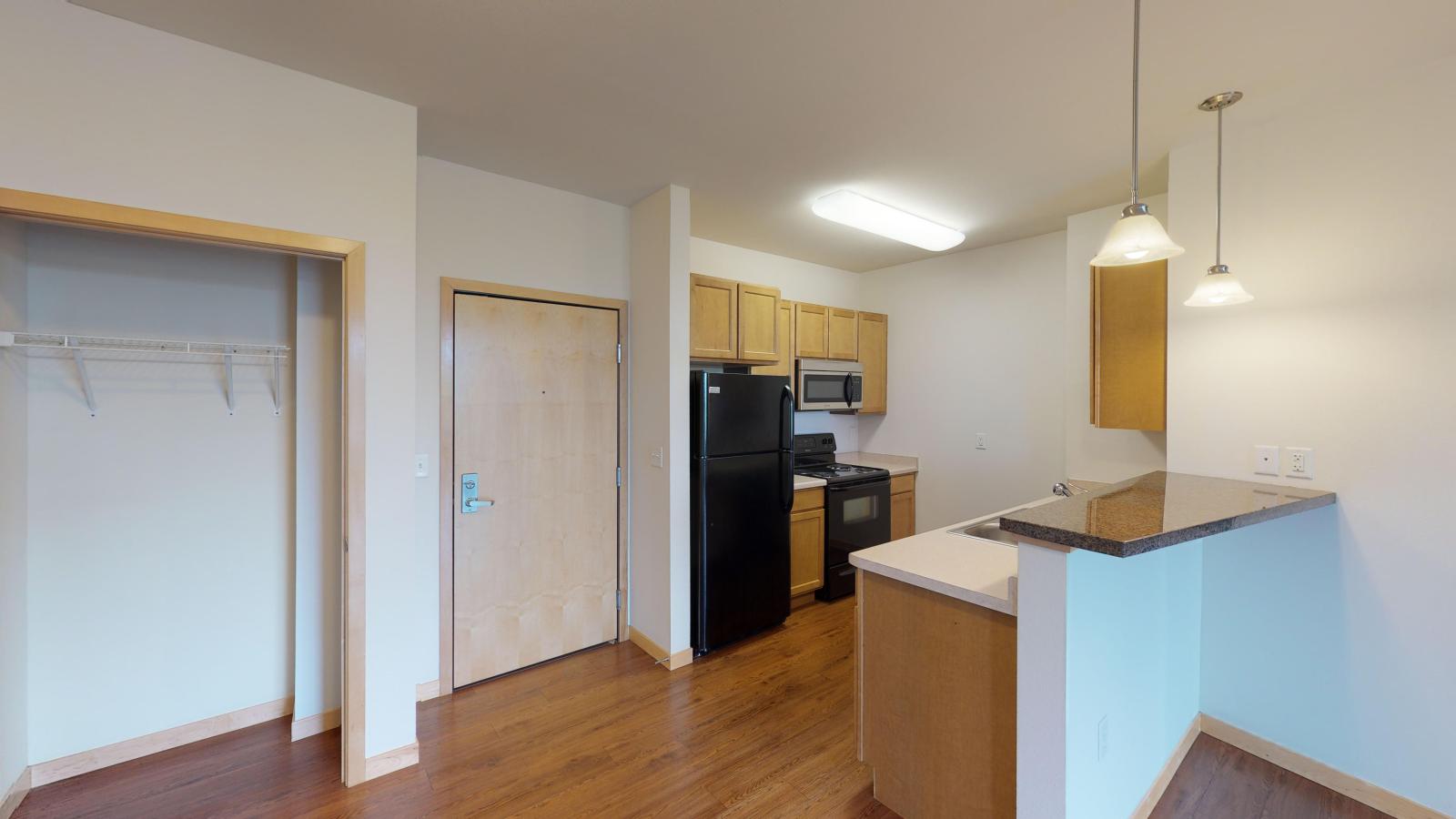 One bedroom plus den apartment with a classic ktichen offering soft finishes and ample storage at The Depot in downtown Madison