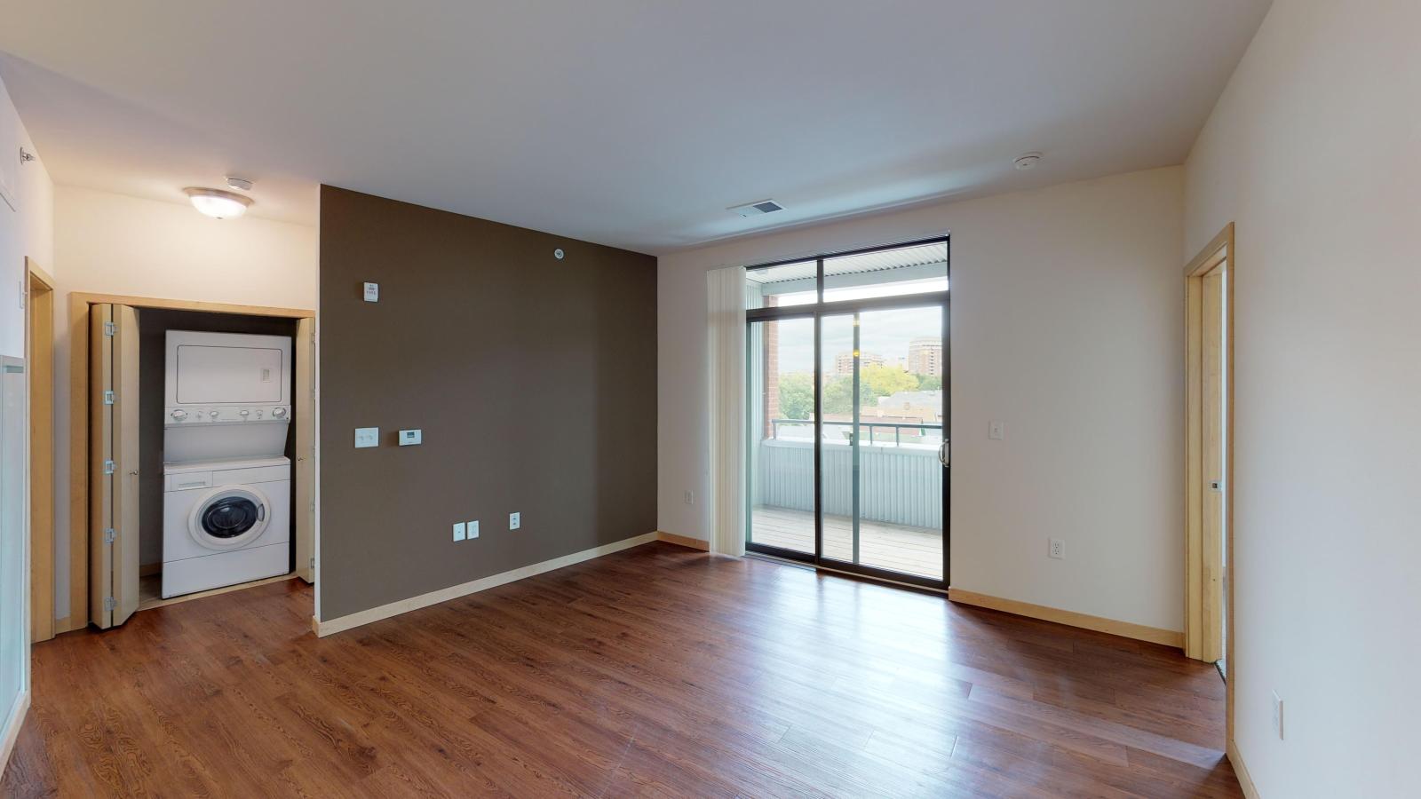 One bedroom plus den apartment with a flexible layout and private balcony at The Depot in downtown Madison