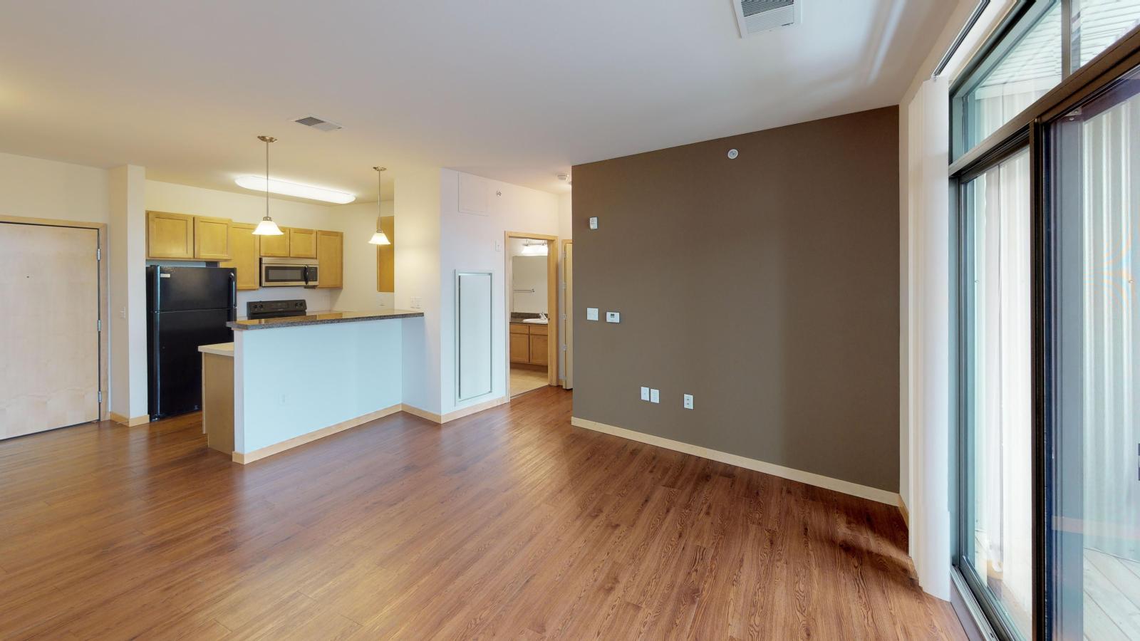 One bedroom plus den apartment with a flexible layout and private balcony at The Depot in downtown Madison