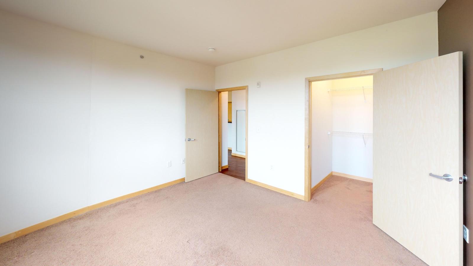 Spacious one bedroom plus den apartment with a walk in closet and natural light in main bedroom at The Depot in downtown Madison