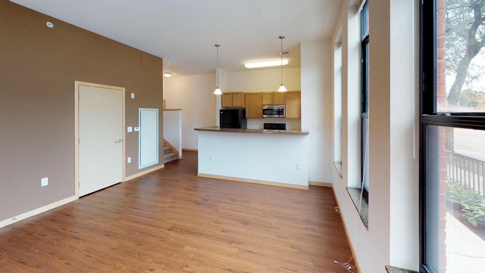 Two story townhome with a large living area and standard kitchen at The Depot in downtown Madison