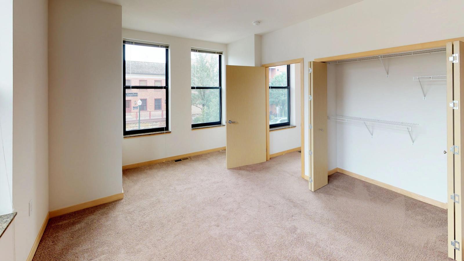 Townhome featuring a traditional layout with carpeted floors and ample closet space at The Depot in downtown Madison