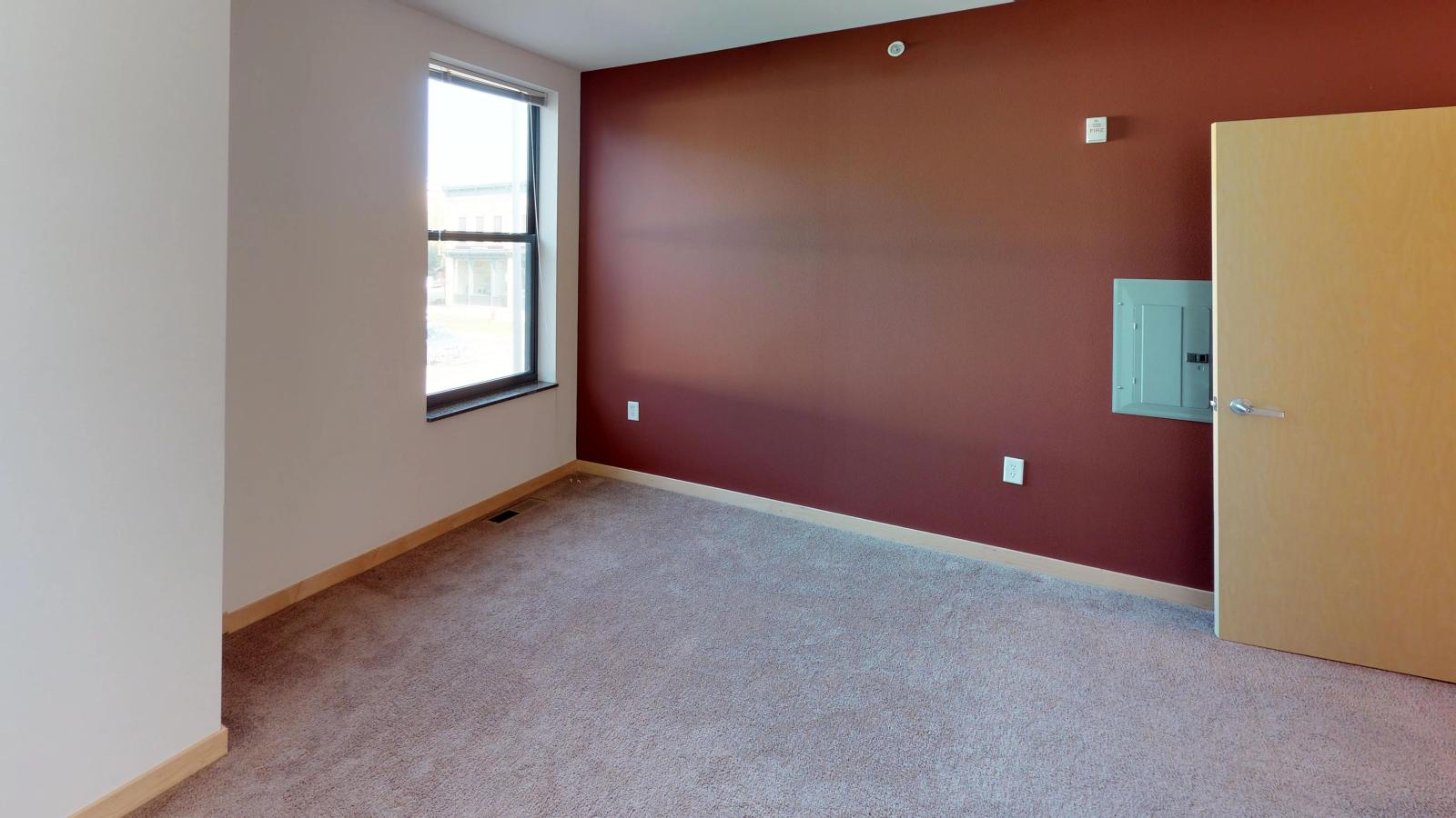 Townhome featuring a traditional layout with carpeted floors and ample closet space at The Depot in downtown Madison