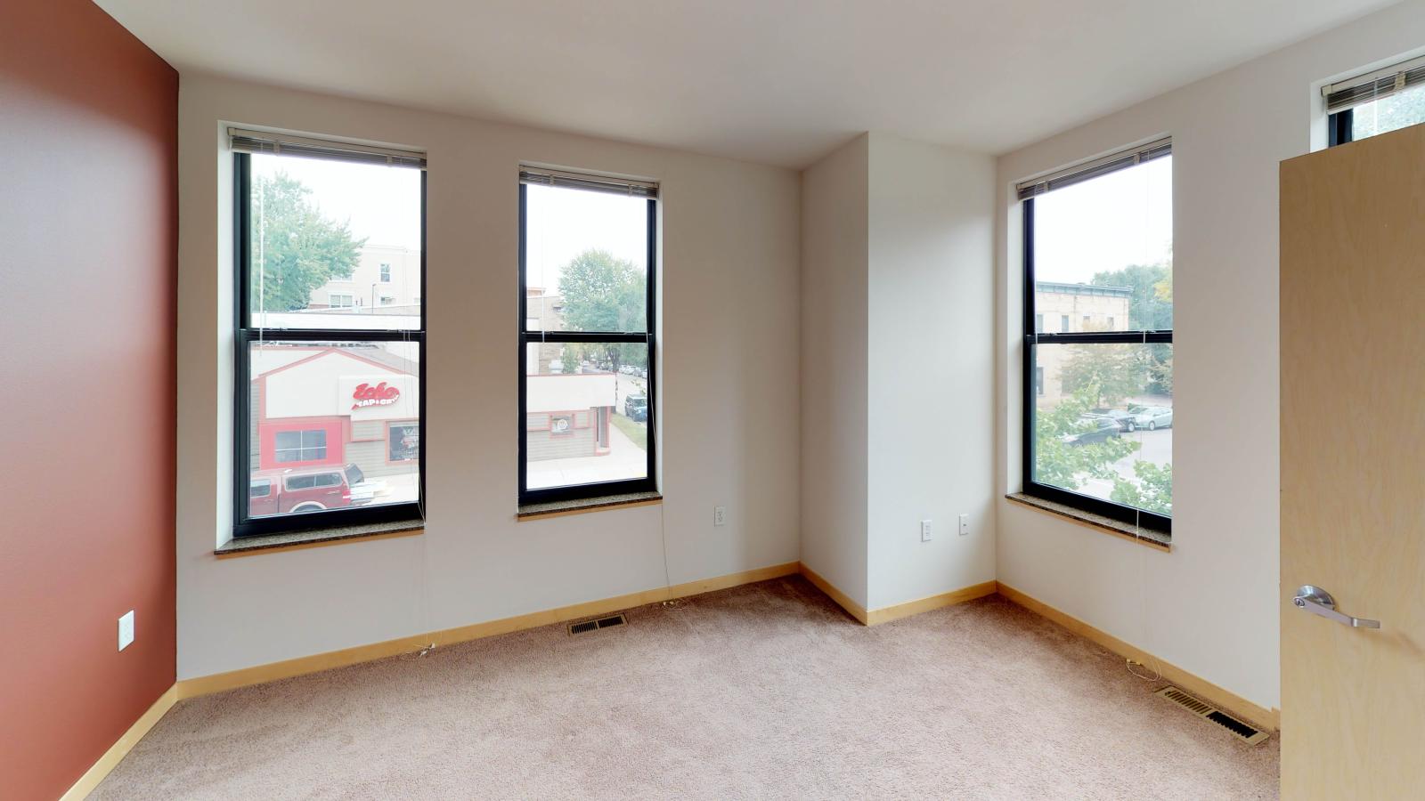Townhome featuring a traditional layout with carpeted floors and ample closet space at The Depot in downtown Madison