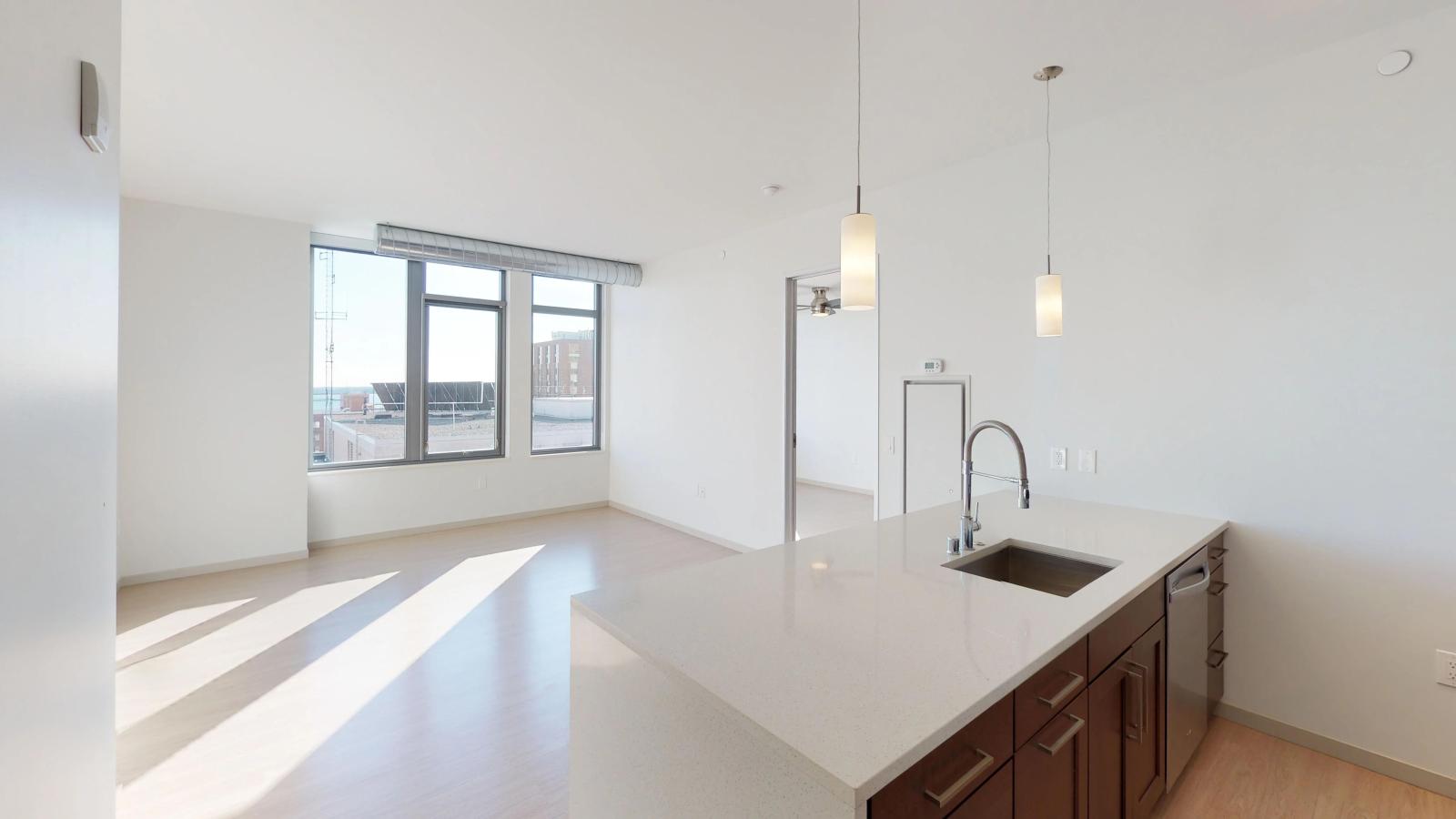 Bright one-bedroom apartment at The Pressman in downtown Madison with open-concept living and lake views.