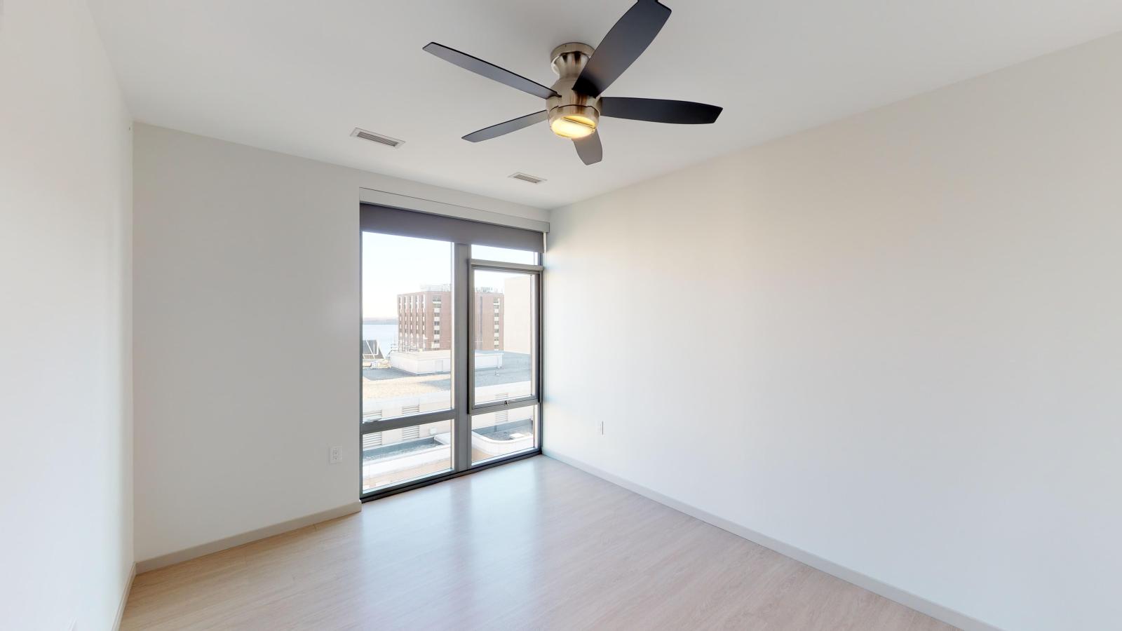 Bright one-bedroom apartment at The Pressman in downtown Madison with open-concept living and lake views.