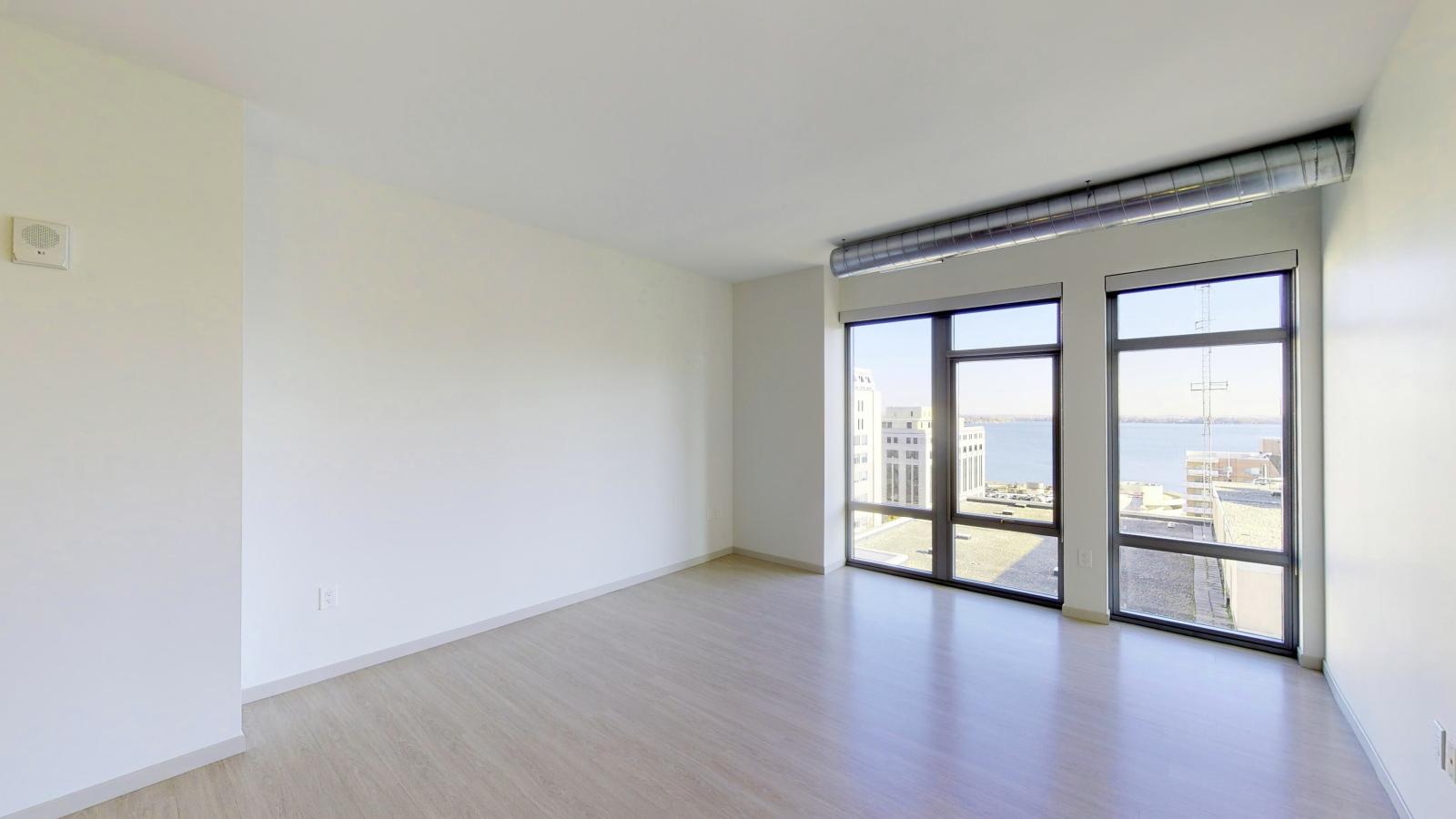 Bright one-bedroom apartment at The Pressman in downtown Madison with open-concept living and lake views.
