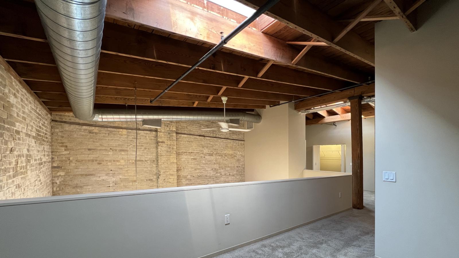 Two bedroom loft featuring large closets and high ceilings and skylights at Tobacco Lofts at The Yards in downtown Madison