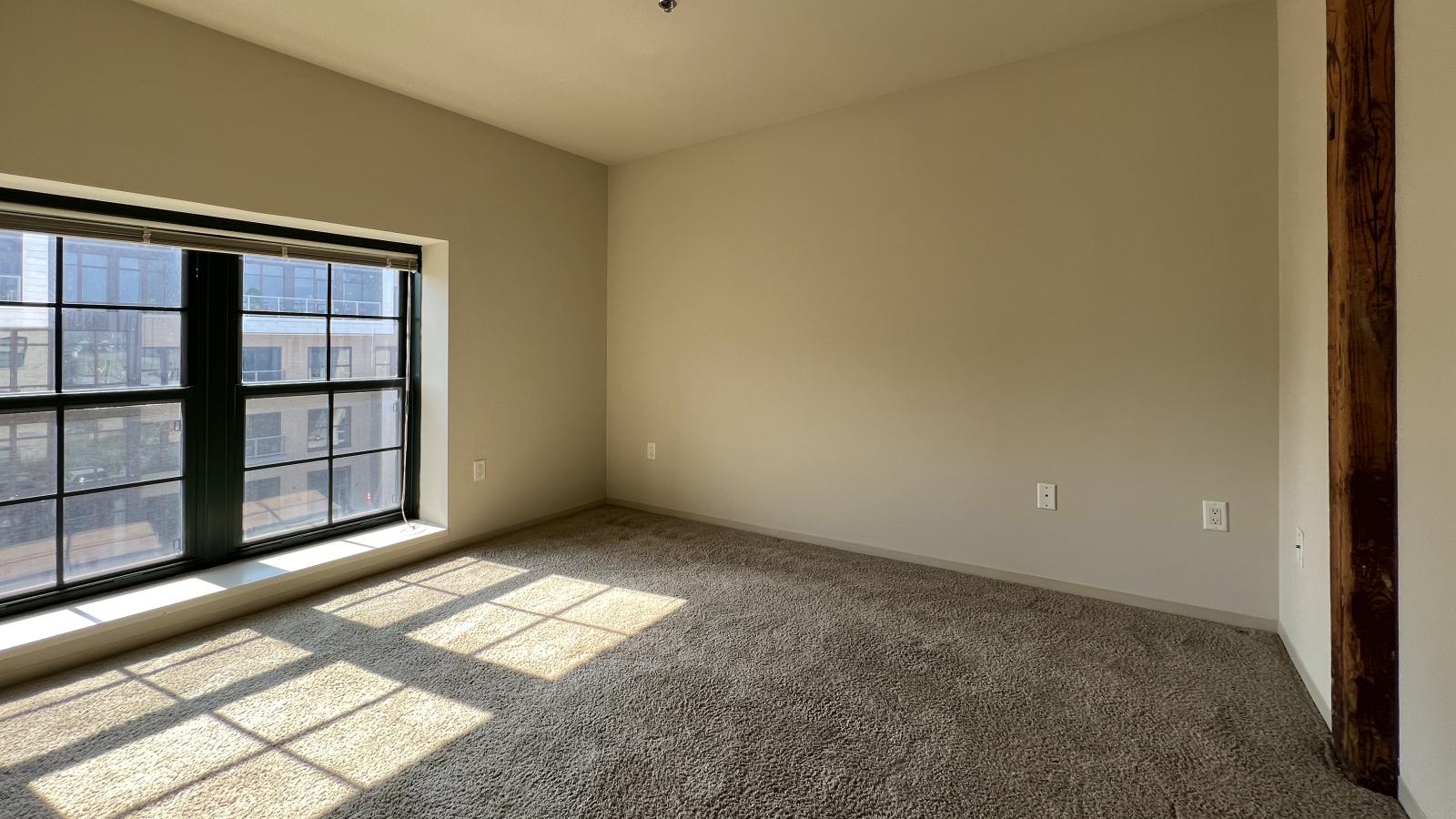 Spacious two bedroom with a unique open loft layout ideal for creative living at Tobacco Lofts at The Yards in downtown Madison