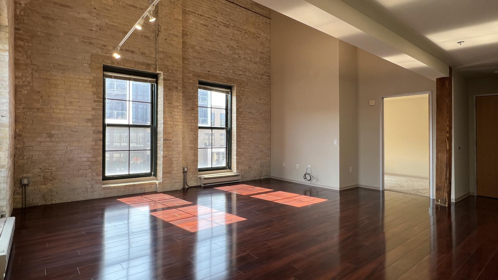 Two bedroom apartment with an upstairs ensuite bathroom featuring soft industrial accents at Tobacco Lofts at The Yards in downtown Madison