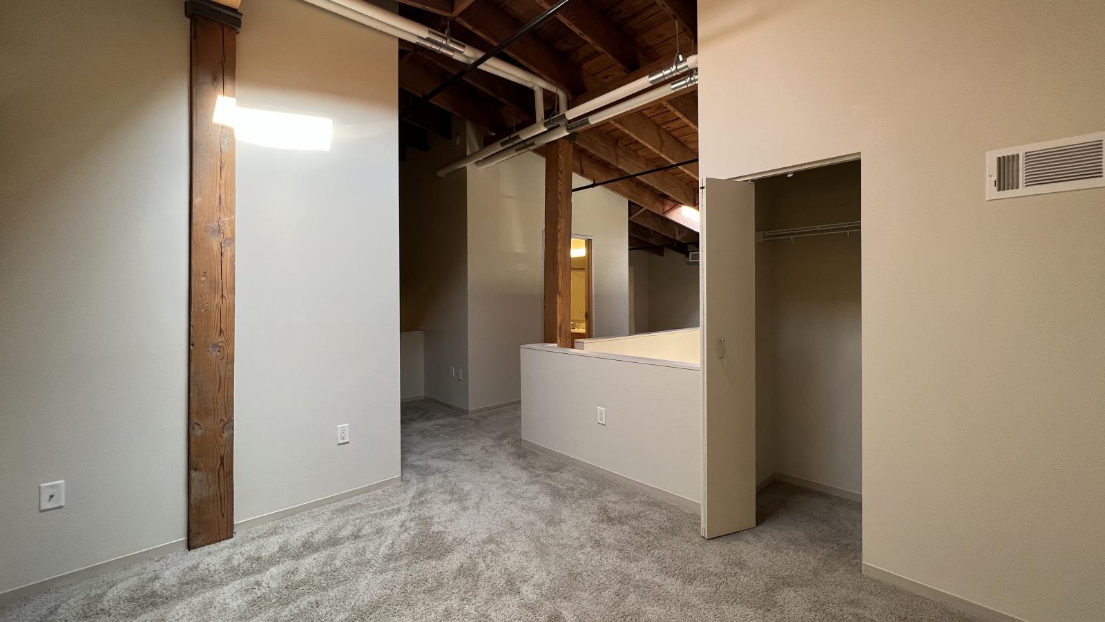 Two bedroom loft featuring large closets and high ceilings and skylights at Tobacco Lofts at The Yards in downtown Madison