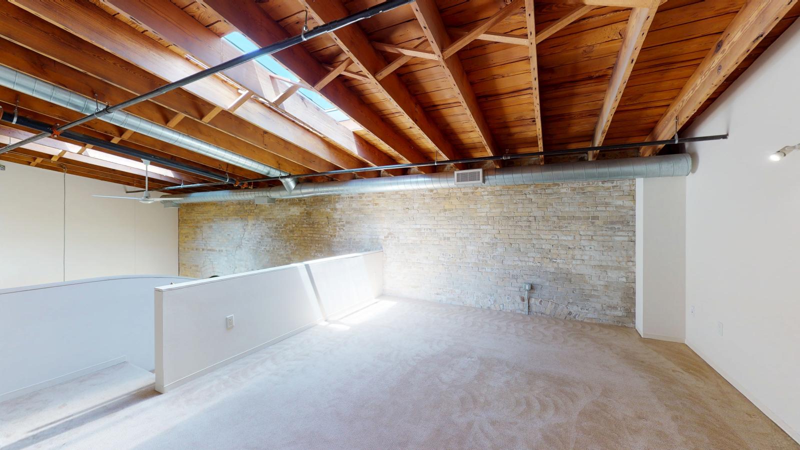 Two bedroom loft featuring large closets and high ceilings and skylights at Tobacco Lofts at The Yards in downtown Madison
