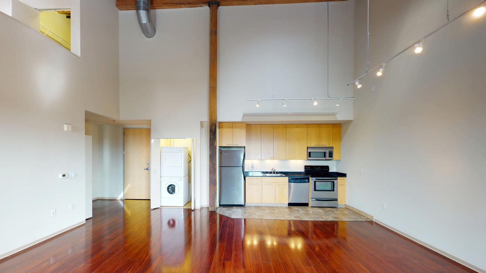 Two bedroom loft featuring large windows high ceilings and ample closet space at Tobacco Lofts at The Yards in downtown Madison