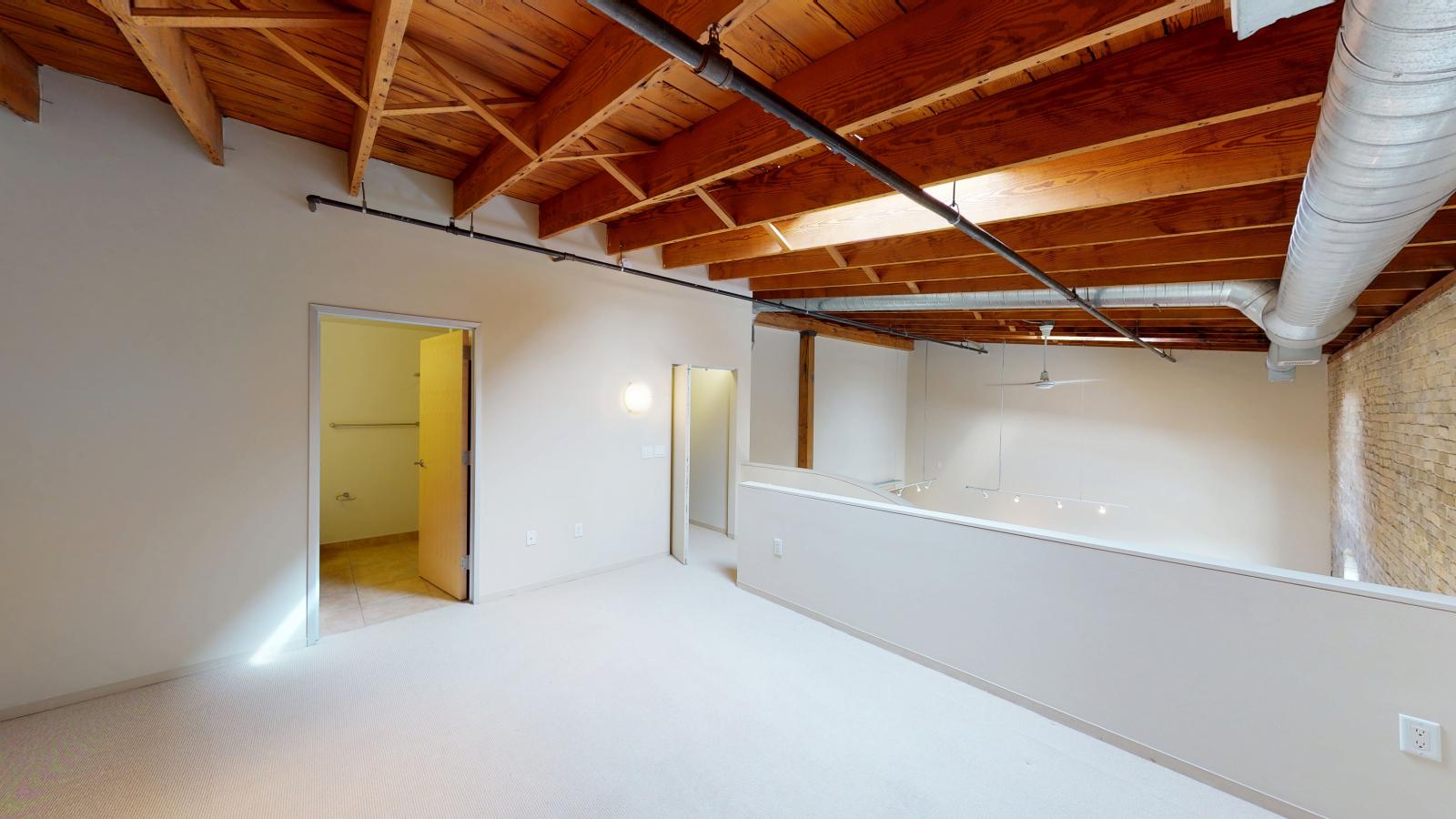 Two bedroom loft featuring large closets and high ceilings and skylights at Tobacco Lofts at The Yards in downtown Madison