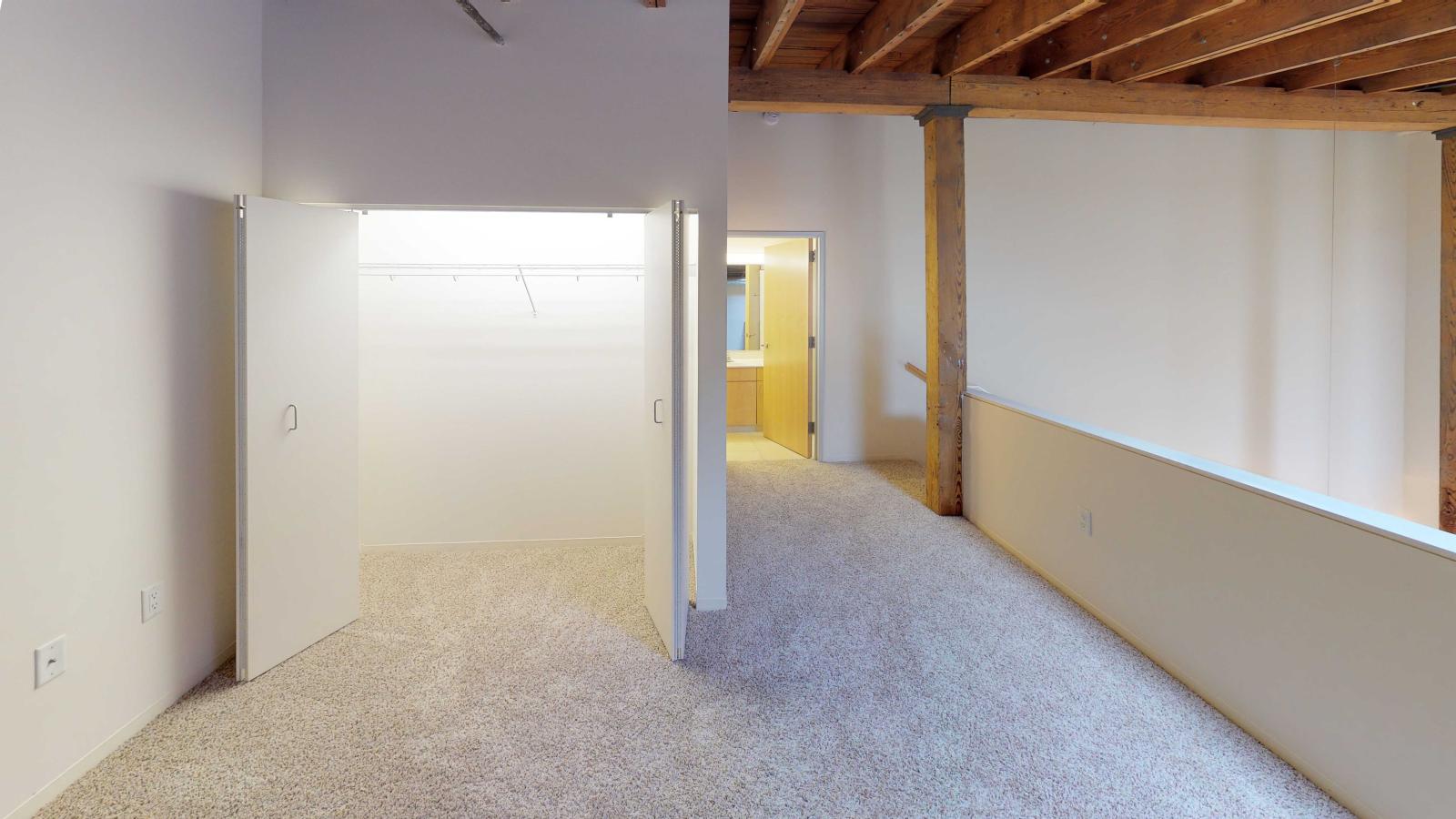 Loft style two bedroom featuring an upstairs primary bathroom with industrial modern finishes at Tobacco Lofts