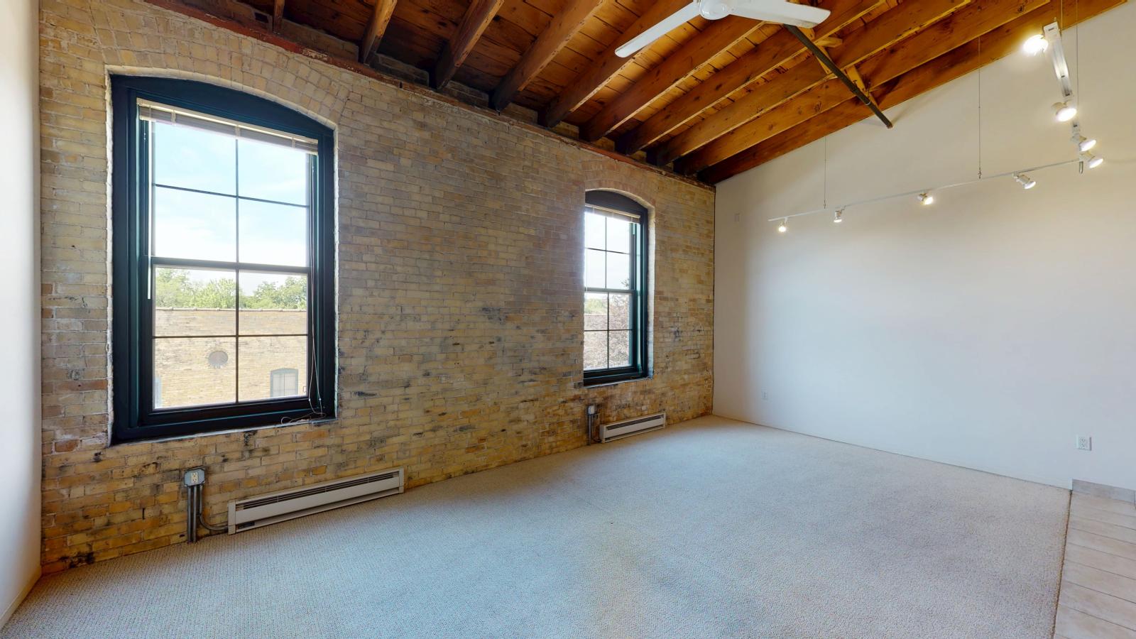 Spacious one bedroom apartment with a blend of historic and contemporary design at Tobacco Lofts at The Yards in downtown Madison