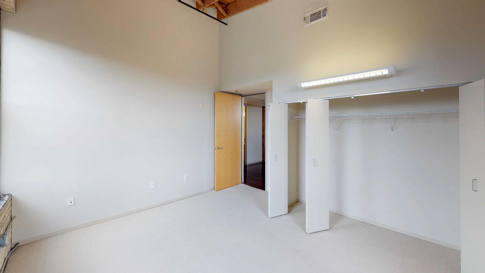Two bedroom loft featuring large closets and high ceilings at Tobacco Lofts