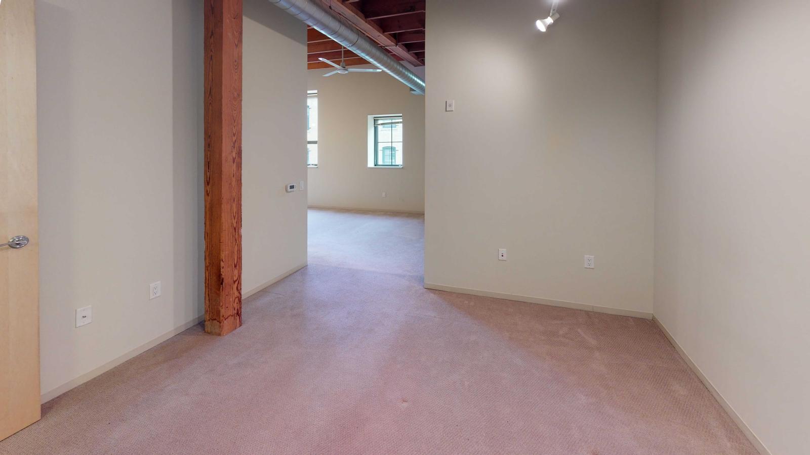 Bright studio apartment with oversized closet and high ceilings at Tobacco Lofts