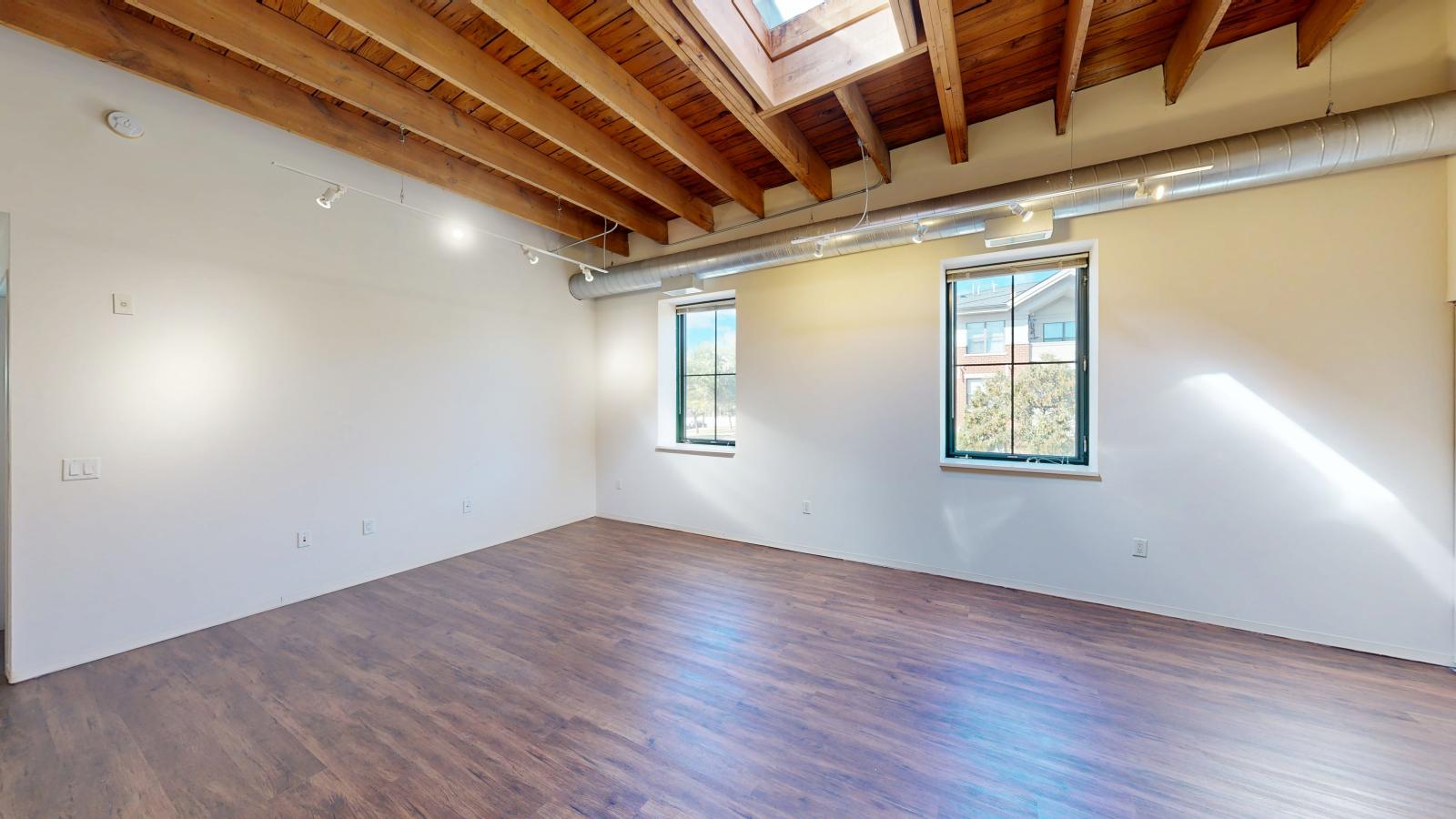 High ceilings with skylight and open layouts emphasizing spacious living areas at Tobacco Lofts at The Yards in downtown Madison