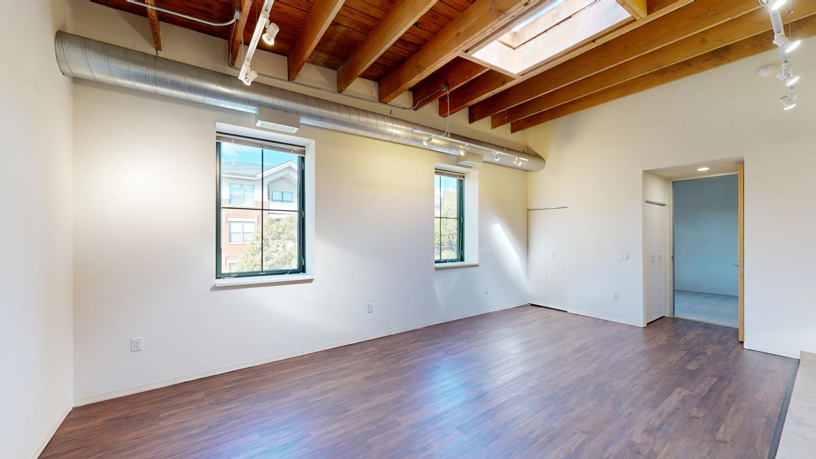 High ceilings with skylight and open layouts emphasizing spacious living areas at Tobacco Lofts at The Yards in downtown Madison