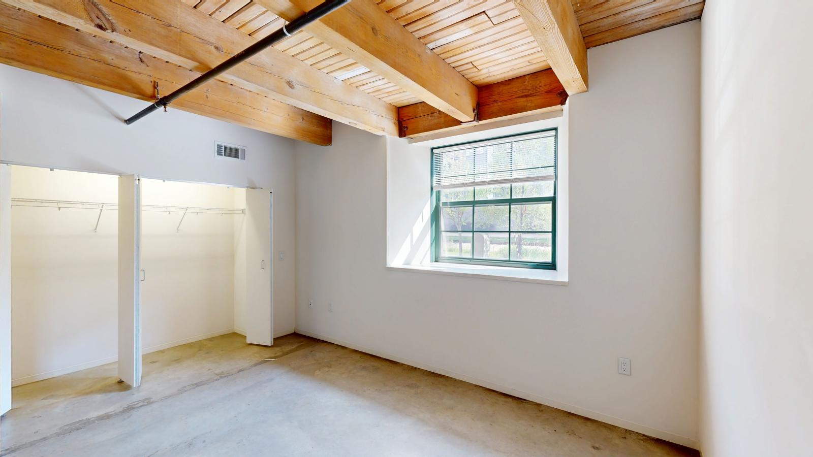 Garden level one bedroom apartment with polished concrete floors at Tobacco Lofts Apartment E103