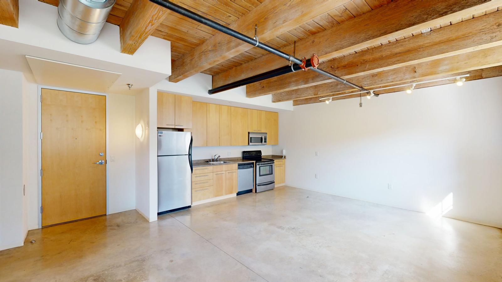 One bedroom apartment with stainless steel appliances at Tobacco Lofts Apartment E103