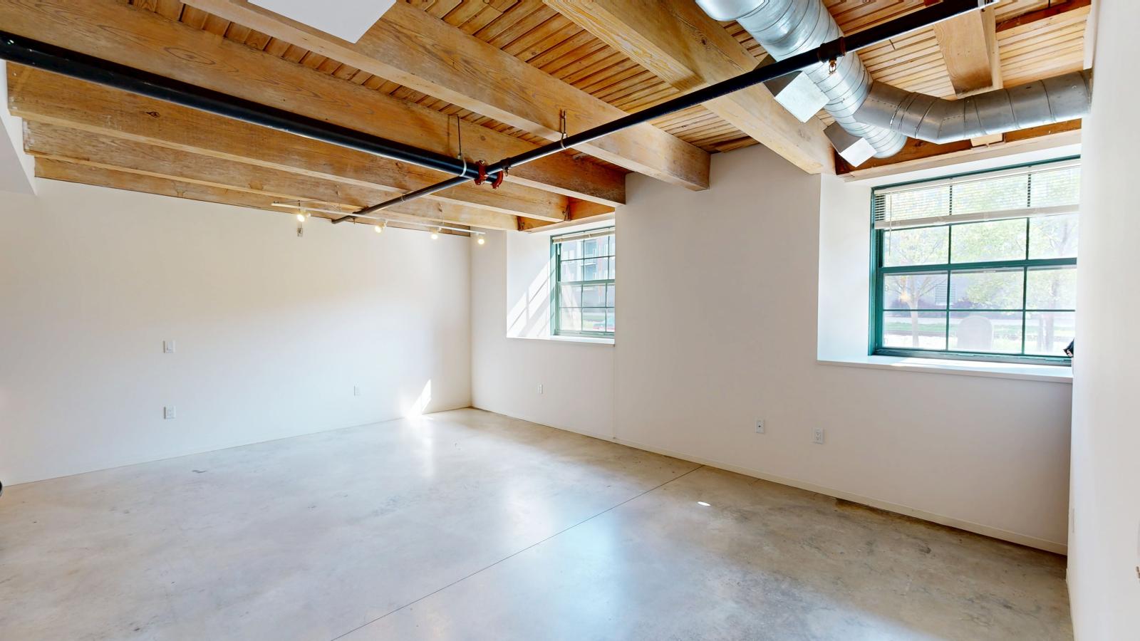 Garden level one bedroom apartment with polished concrete floors at Tobacco Lofts Apartment E103